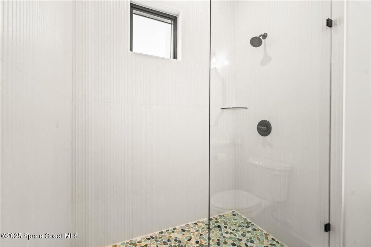 225 Strand Drive, Unit 401 Melbourne Beach, FL 32951 - Photo 28 of 51 a bathroom with a shower