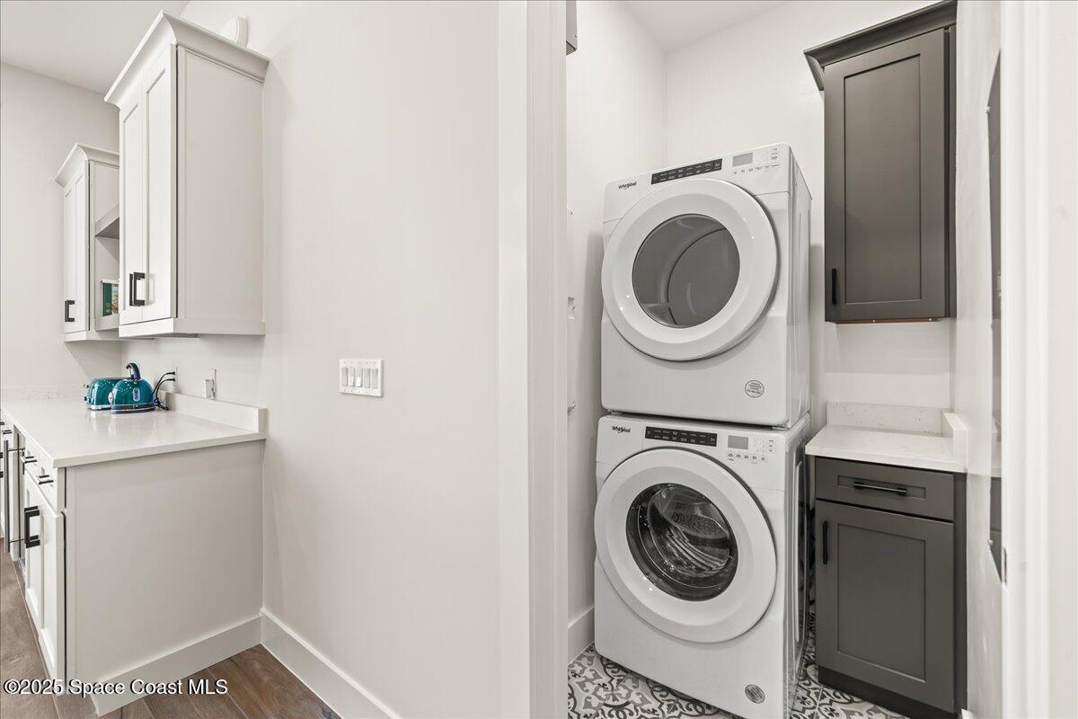 225 Strand Drive, Unit 401 Melbourne Beach, FL 32951 - Photo 33 of 51 a utility room with sink dryer and washer