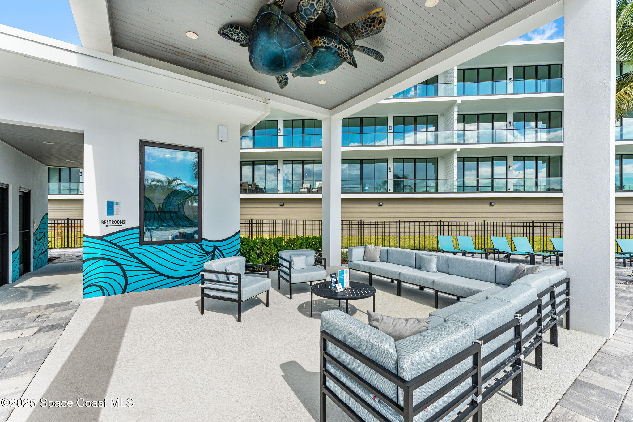 225 Strand Drive, Unit 401 Melbourne Beach, FL 32951 - Photo 45 of 51 a building outdoor space with patio furniture