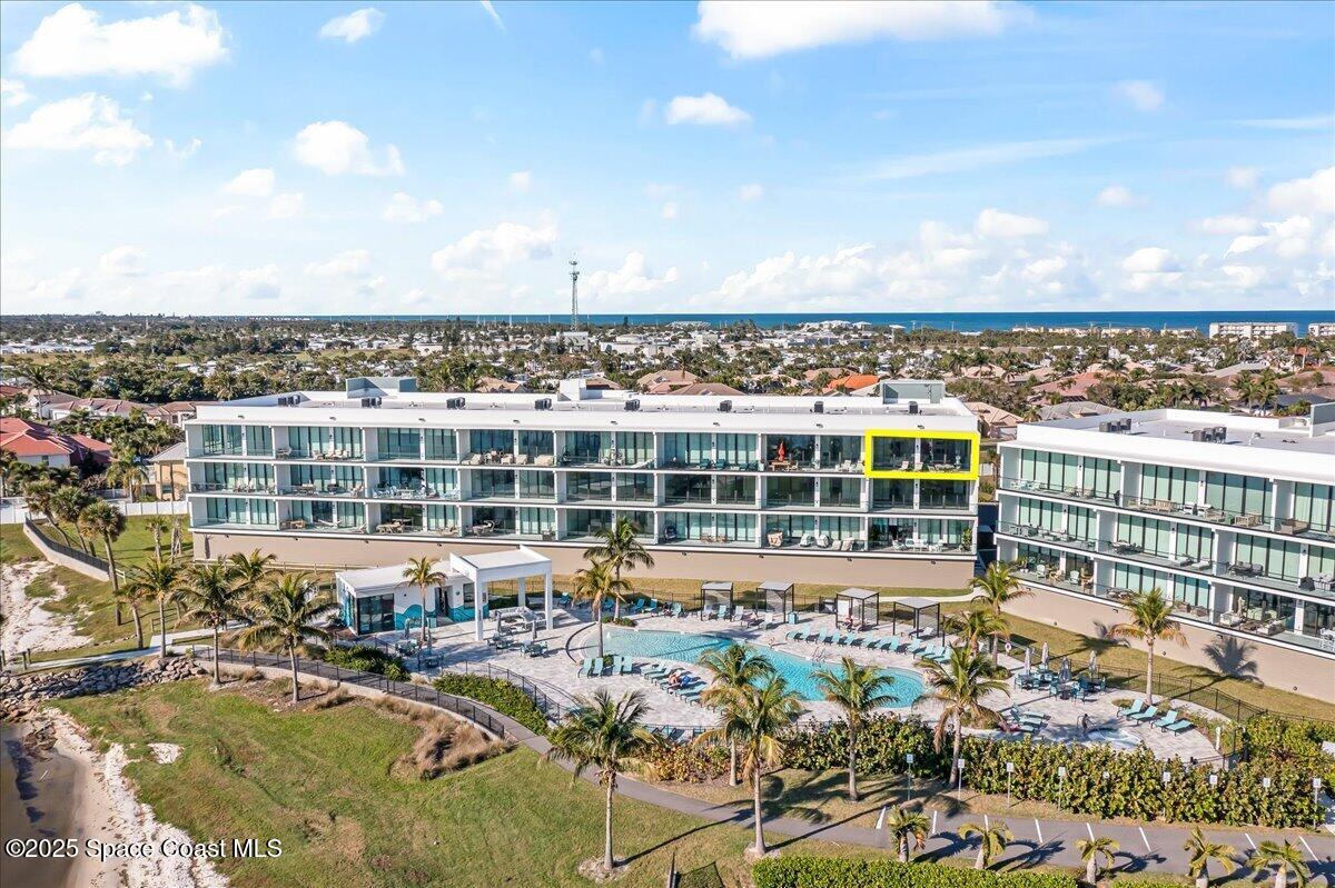 225 Strand Drive, Unit 401 Melbourne Beach, FL 32951 - Photo 5 of 51 a view of a swimming pool and lake view