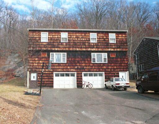 24 Juniper Road Bethel, CT 06801 - Photo 1 of 1 a front view of a building with parking