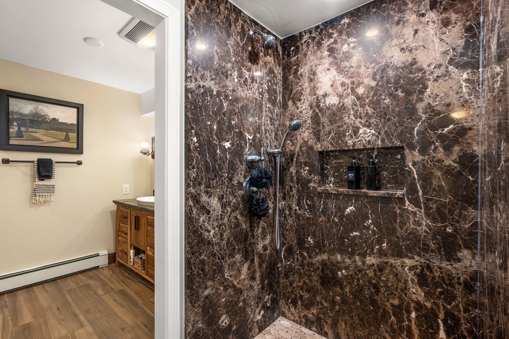 101 Summit Avenue, Unit E Brookline, MA 02446 - Photo 14 of 22 a bathroom with a shower and a sink