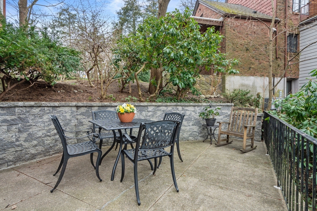 101 Summit Avenue, Unit E Brookline, MA 02446 - Photo 17 of 22 a view of an outdoor space with table and chairs
