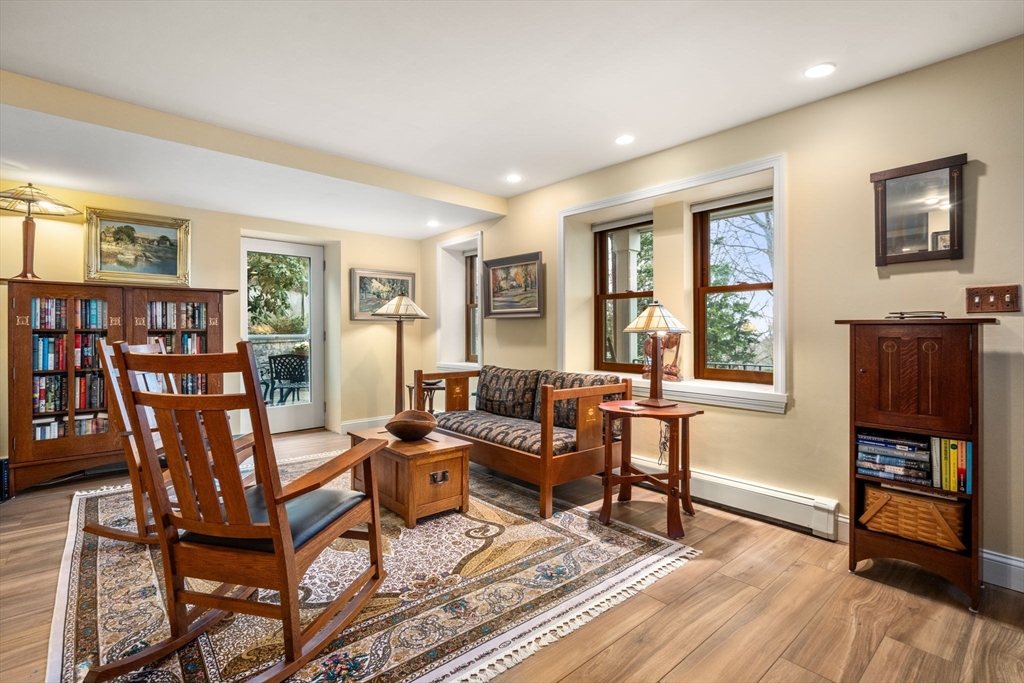 101 Summit Avenue, Unit E Brookline, MA 02446 - Photo 5 of 22 a living room with furniture and a wooden floor