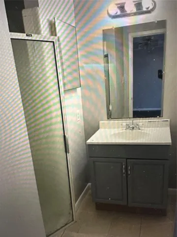 a bathroom with a sink and mirror