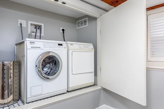 a utility room with dryer and washer