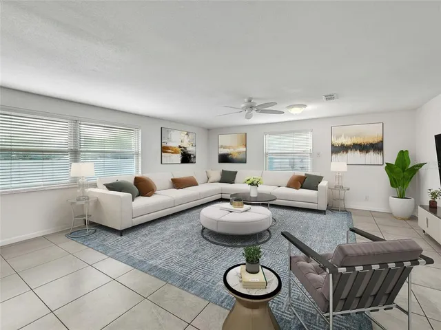 a living room with furniture and a table