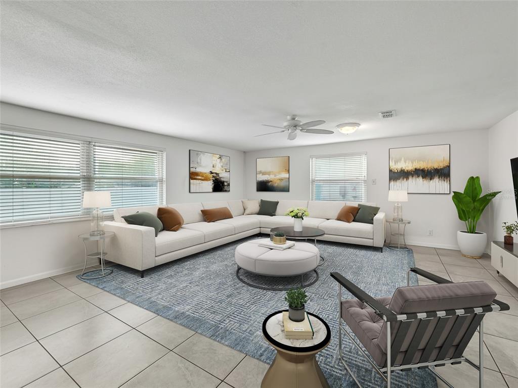 3509 King George Lane Seffner, FL 33584 - Photo 13 of 39 a living room with furniture and a table