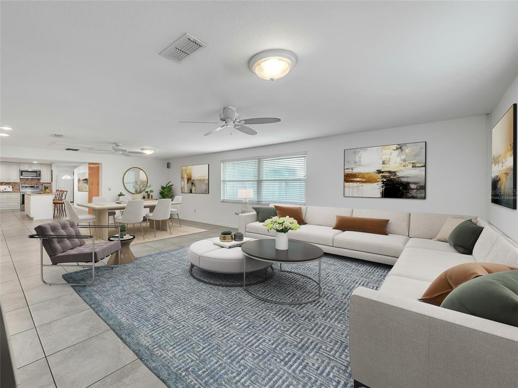 3509 King George Lane Seffner, FL 33584 - Photo 14 of 39 a living room with furniture and a large window