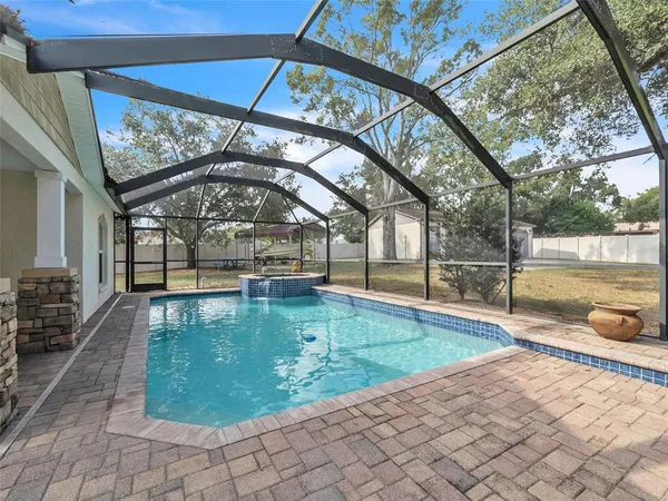 a view of a swimming pool with a patio