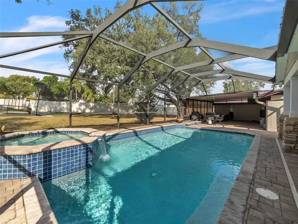 a view of a swimming pool with a patio
