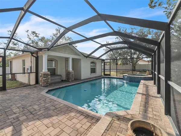 a view of swimming pool with a patio