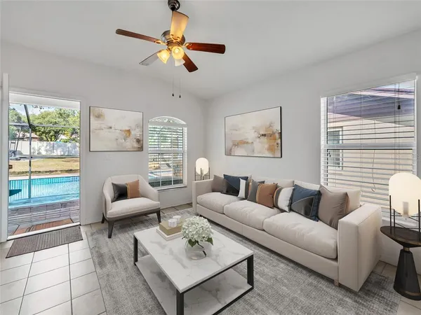 a living room with furniture and a large window
