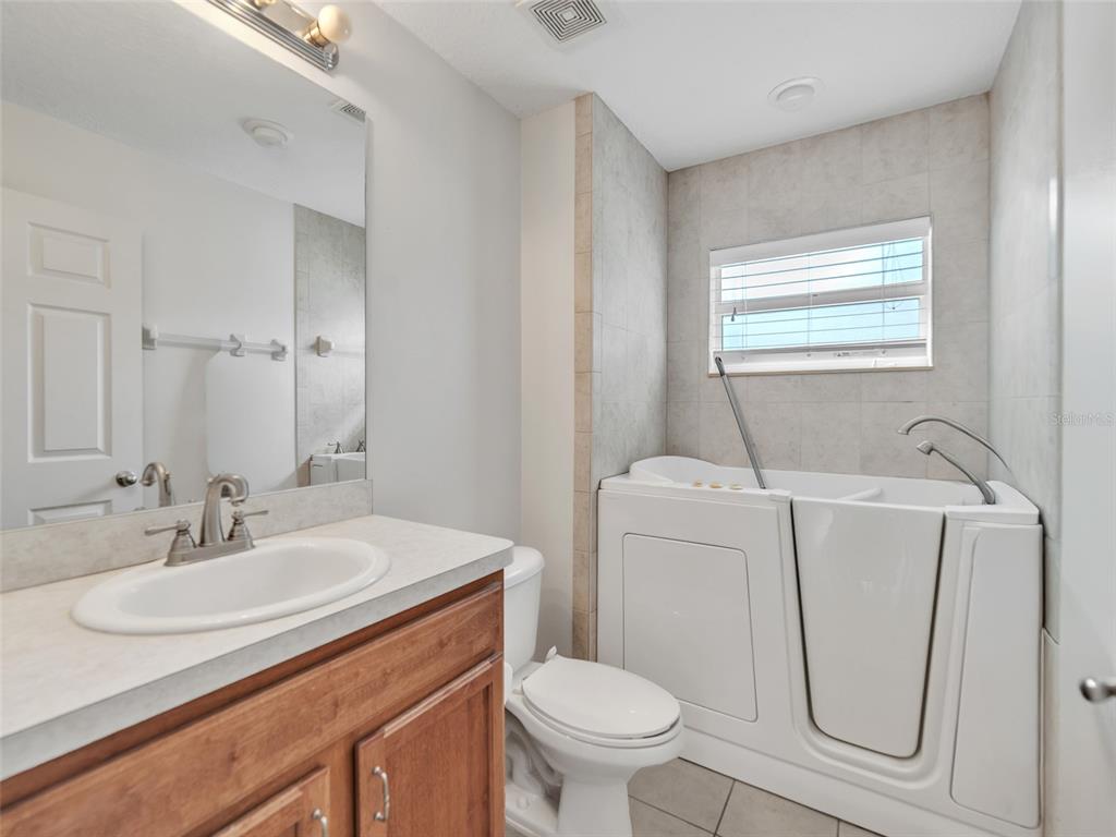 3509 King George Lane Seffner, FL 33584 - Photo 26 of 39 a bathroom with a sink toilet and a mirror