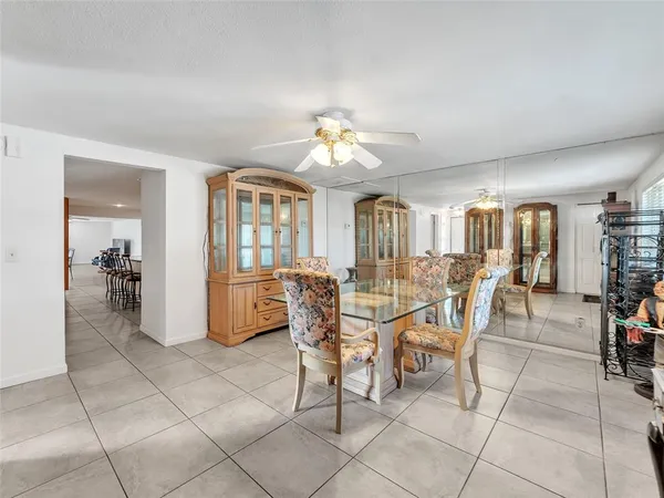 a dining room with furniture and a chandelier