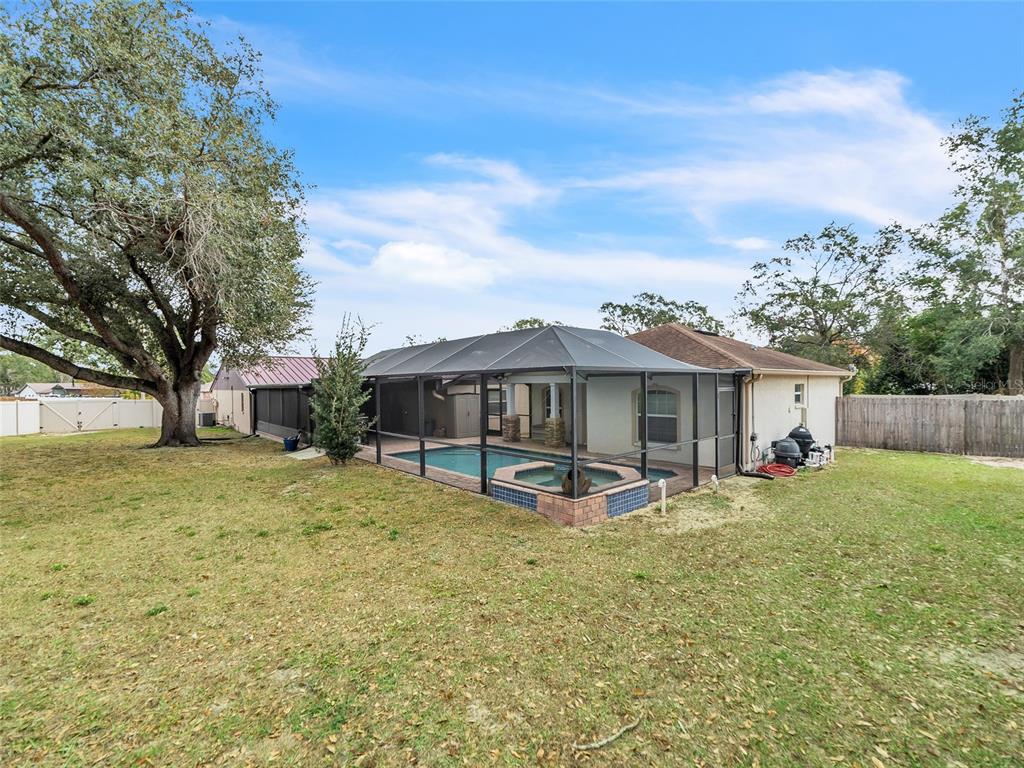 3509 King George Lane Seffner, FL 33584 - Photo 31 of 39 a view of a house with a yard and sitting area
