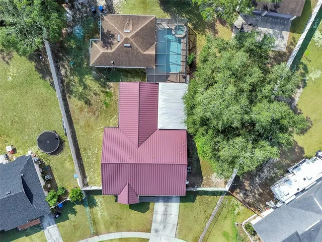 an aerial view of residential houses with outdoor space
