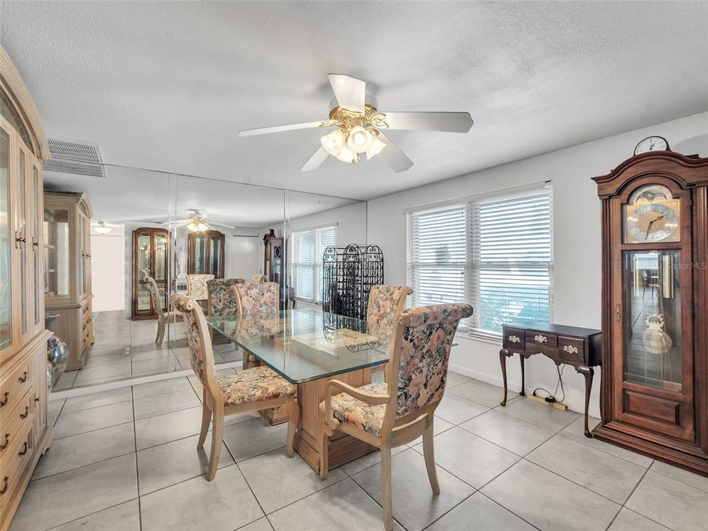 3509 King George Lane Seffner, FL 33584 - Photo 4 of 39 a view of a dining room with furniture and a large window