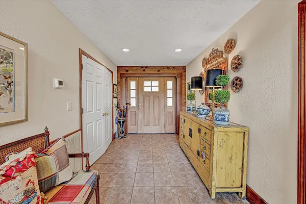 a living room with furniture wooden floor and a fireplace