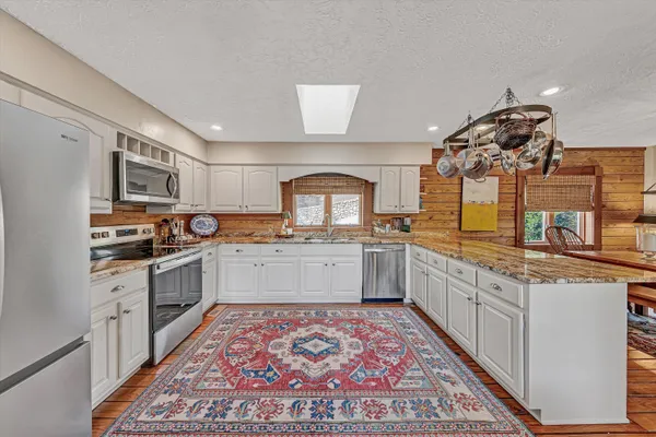 a living room with furniture and a rug