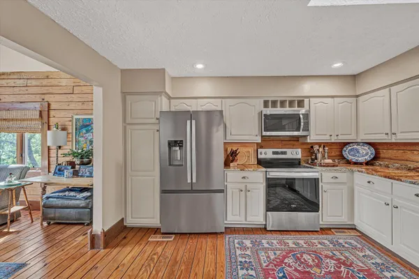 a view of a patio with wooden floor