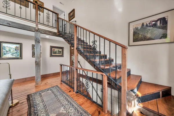 a view of a porch with wooden floor and stairs