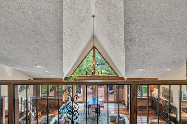 a view of a wooden deck with a yard