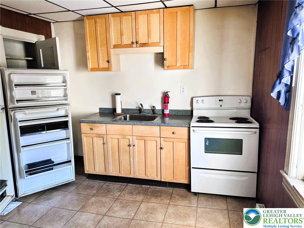 37 South 7th Street Easton, PA 18042 - Photo 12 of 23 a kitchen with white cabinets and appliances