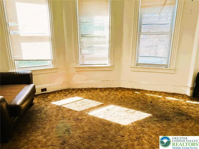 a view of a bedroom and a window