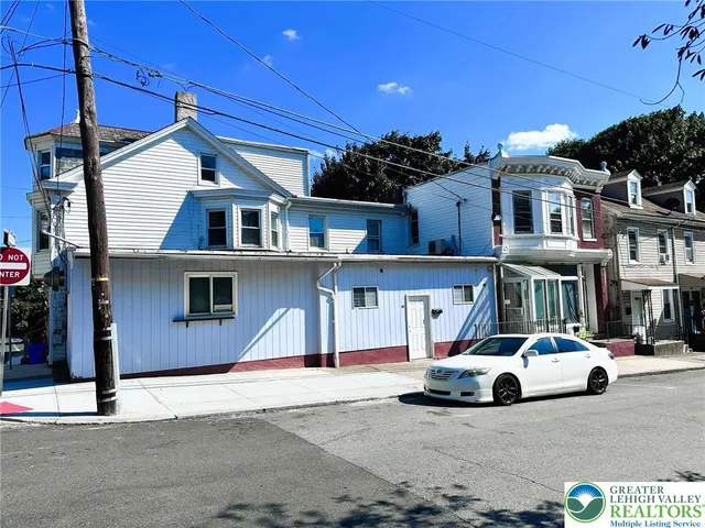 a car parked in front of a house