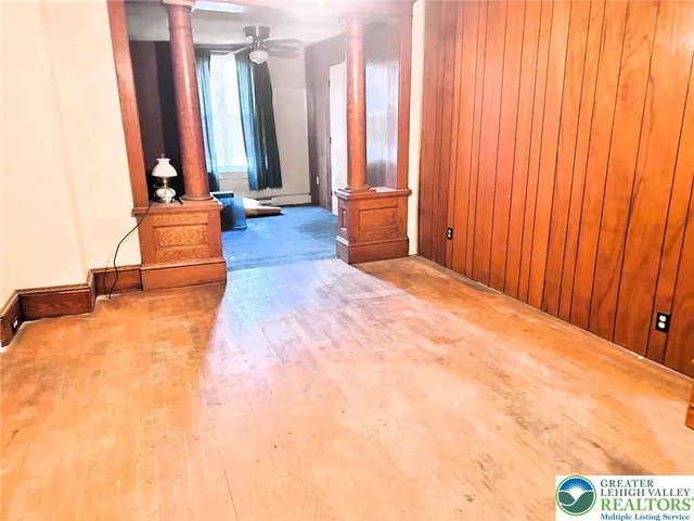 a view of a room with large windows