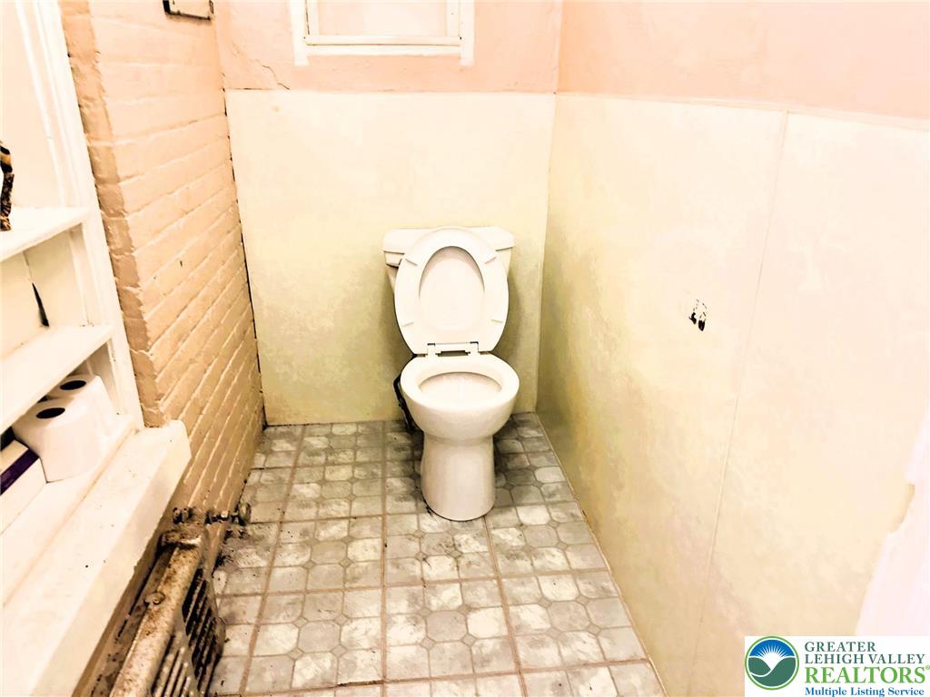 37 South 7th Street Easton, PA 18042 - Photo 9 of 23 a bathroom with a toilet and a sink