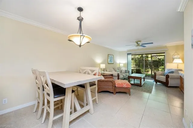 a kitchen with a white cabinets and window