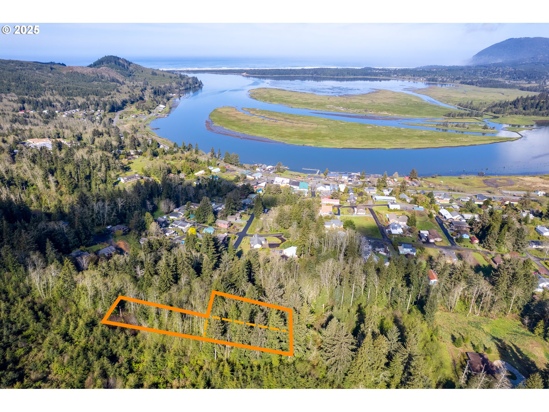 Rector Street, Unit TL 0502 Wheeler, OR 97147 - Photo 2 of 11 a view of a city with mountains in the background