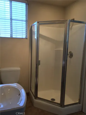 a bathroom with a bathtub and a shower