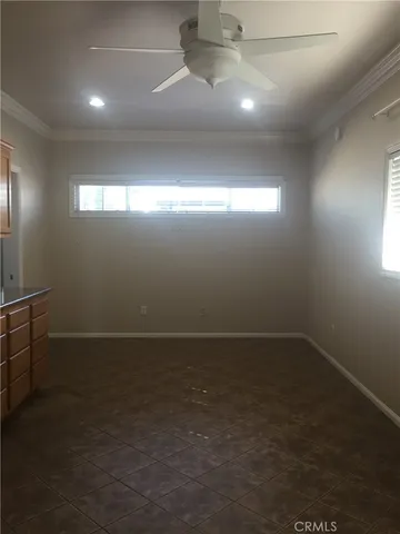 an empty room with a empty space and windows