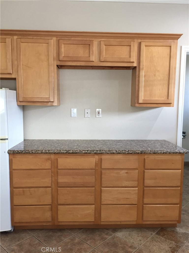 708 Delaware Street, Unit A Huntington Beach, CA 92648 - Photo 8 of 13 a bathroom with a granite countertop sink and a mirror
