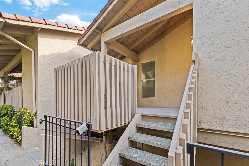 2352 Altisma Way, Unit 4 Carlsbad, CA 92009 - Photo 4 of 32 Front entrance with cozy patio