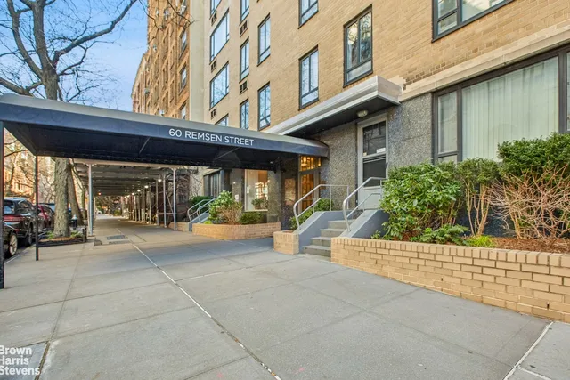 a view of a building with sitting area