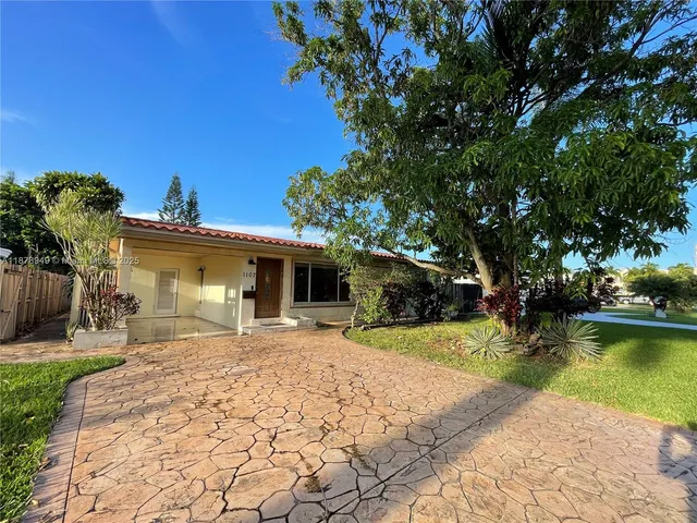 a view of a house with a park