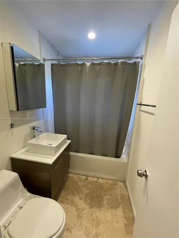 a view of a storage & utility room with a washer and dryer