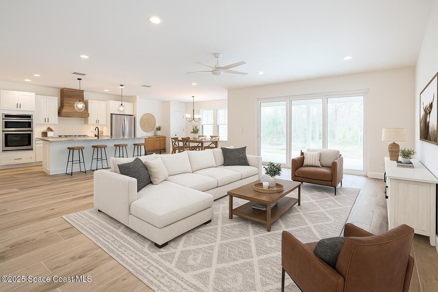 6110 Brabrook Avenue Grant, FL 32949 - Photo 12 of 85 a living room with furniture and a large window