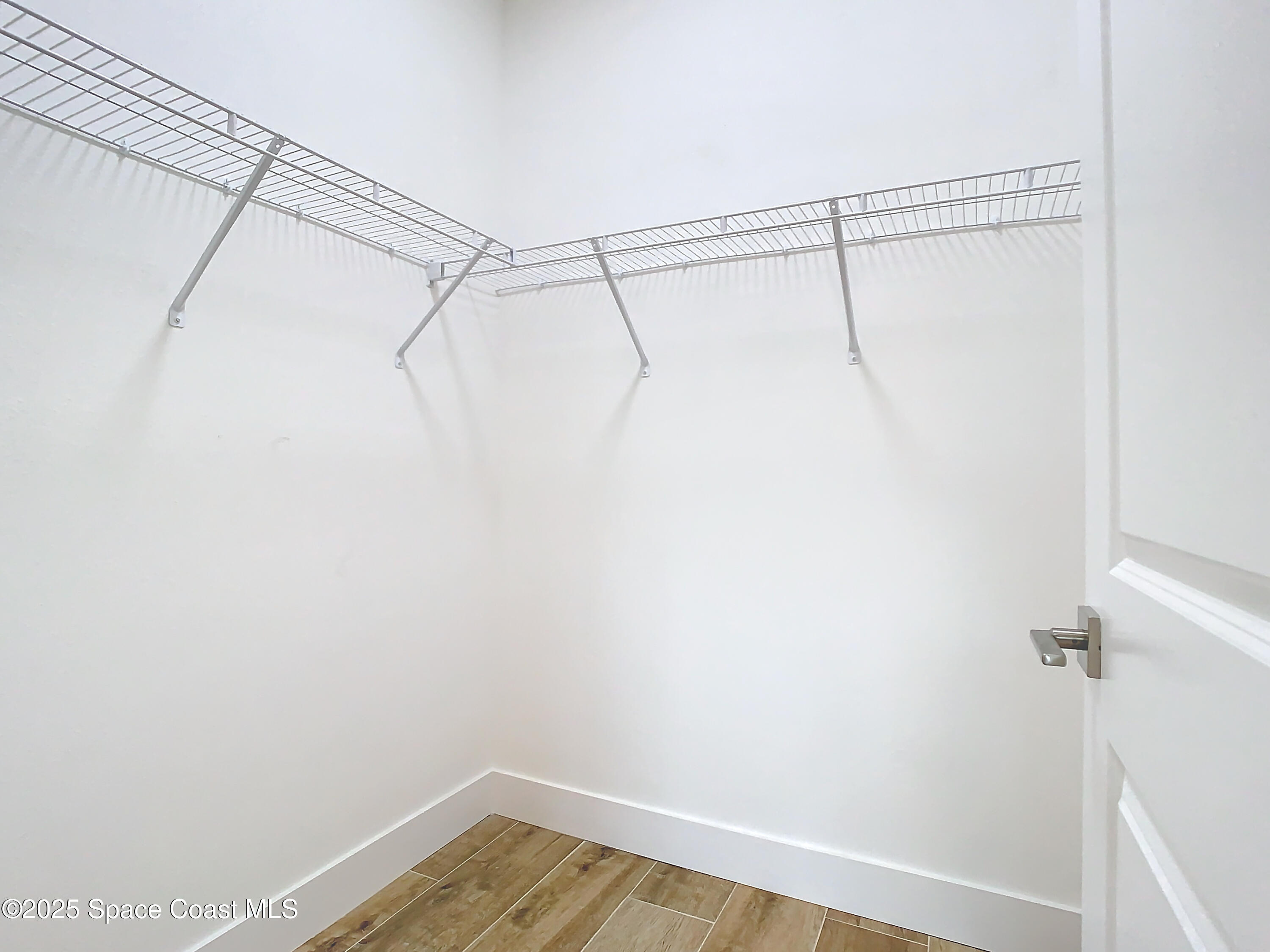 6110 Brabrook Avenue Grant, FL 32949 - Photo 49 of 85 a view of a room with racks on the wall