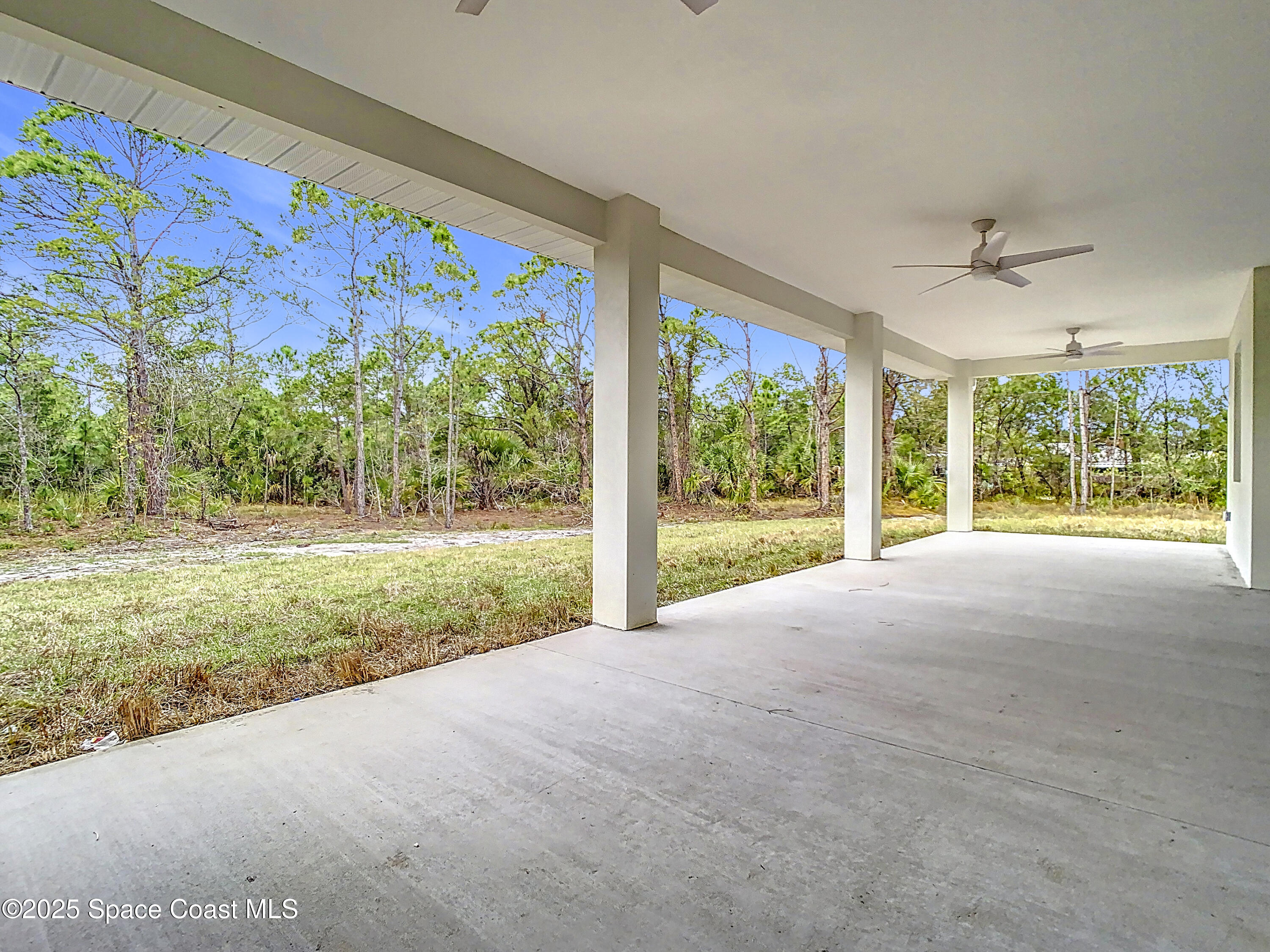 6110 Brabrook Avenue Grant, FL 32949 - Photo 61 of 85 a view of a garden area with large trees