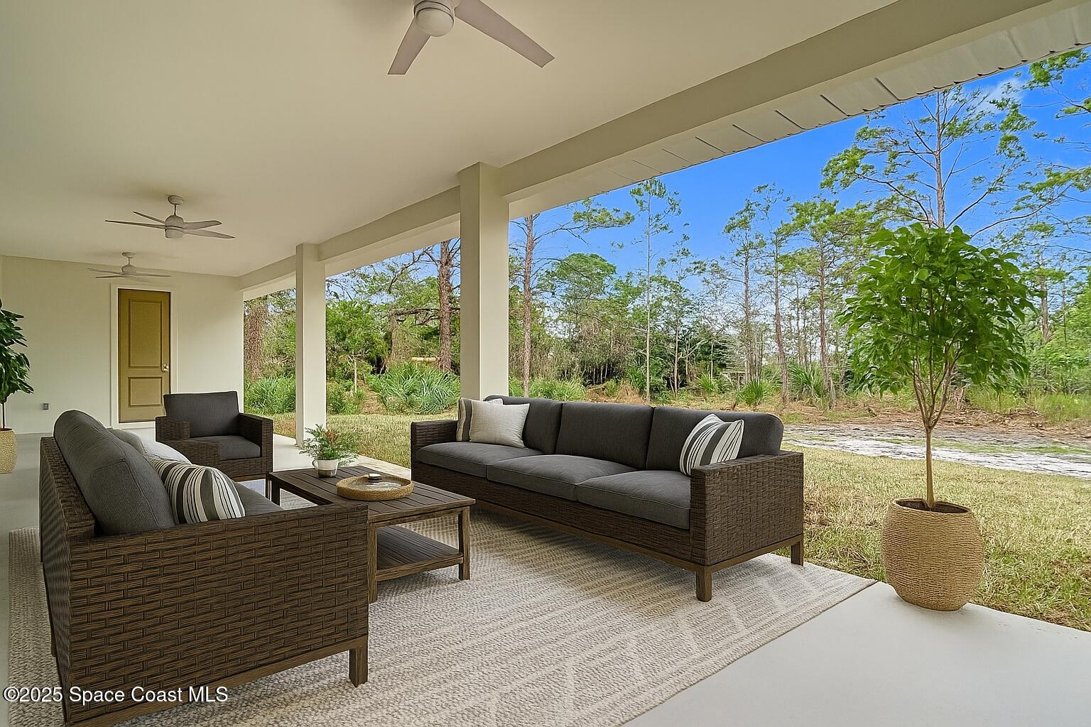 6110 Brabrook Avenue Grant, FL 32949 - Photo 66 of 85 a living room with furniture and a large window