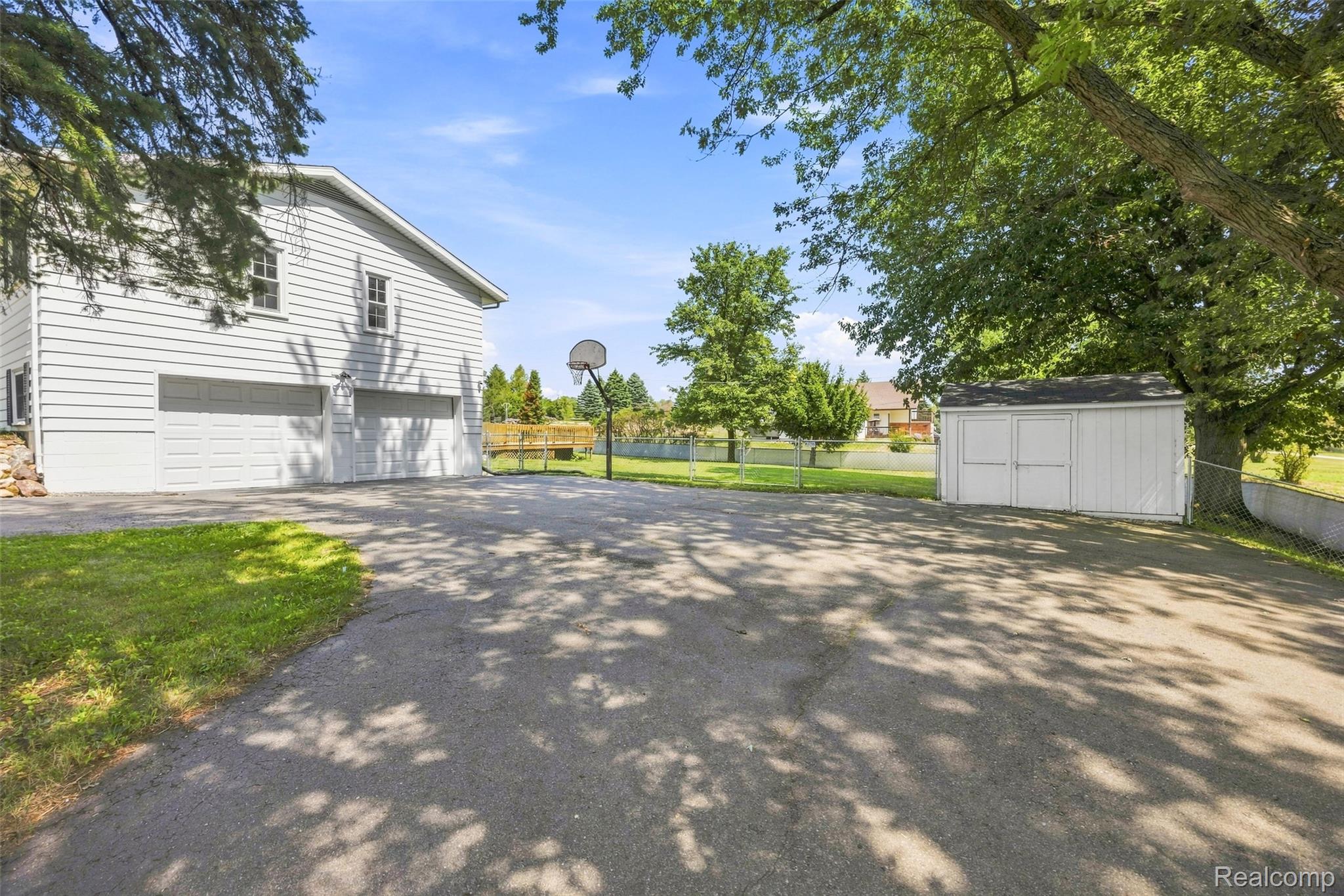 9805 Platt Road Milan, MI 48160 - Photo 42 of 49 55_side of home and shed.jpg