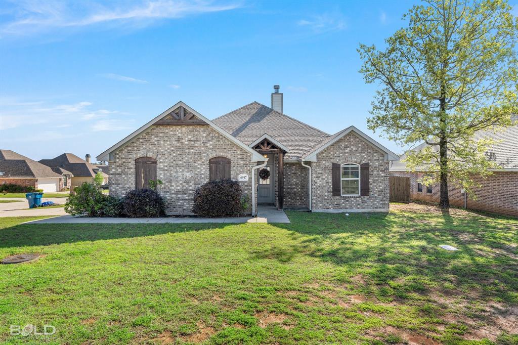 4917 Players Loop Blanchard, LA 71107 - Photo 1 of 1 a front view of a house with yard and green space