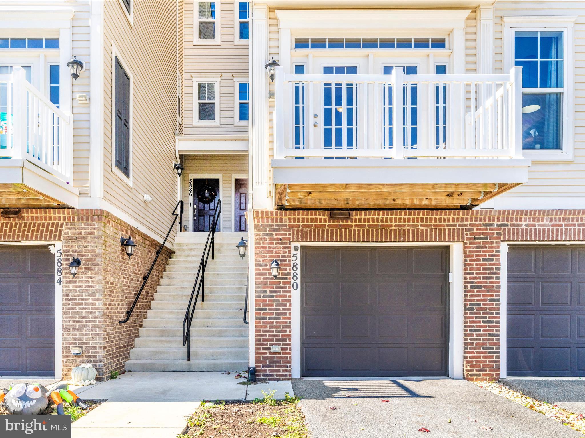 5880 Imperial Drive Frederick, MD 21703 - Photo 1 of 54 a front view of a building with a outdoor space