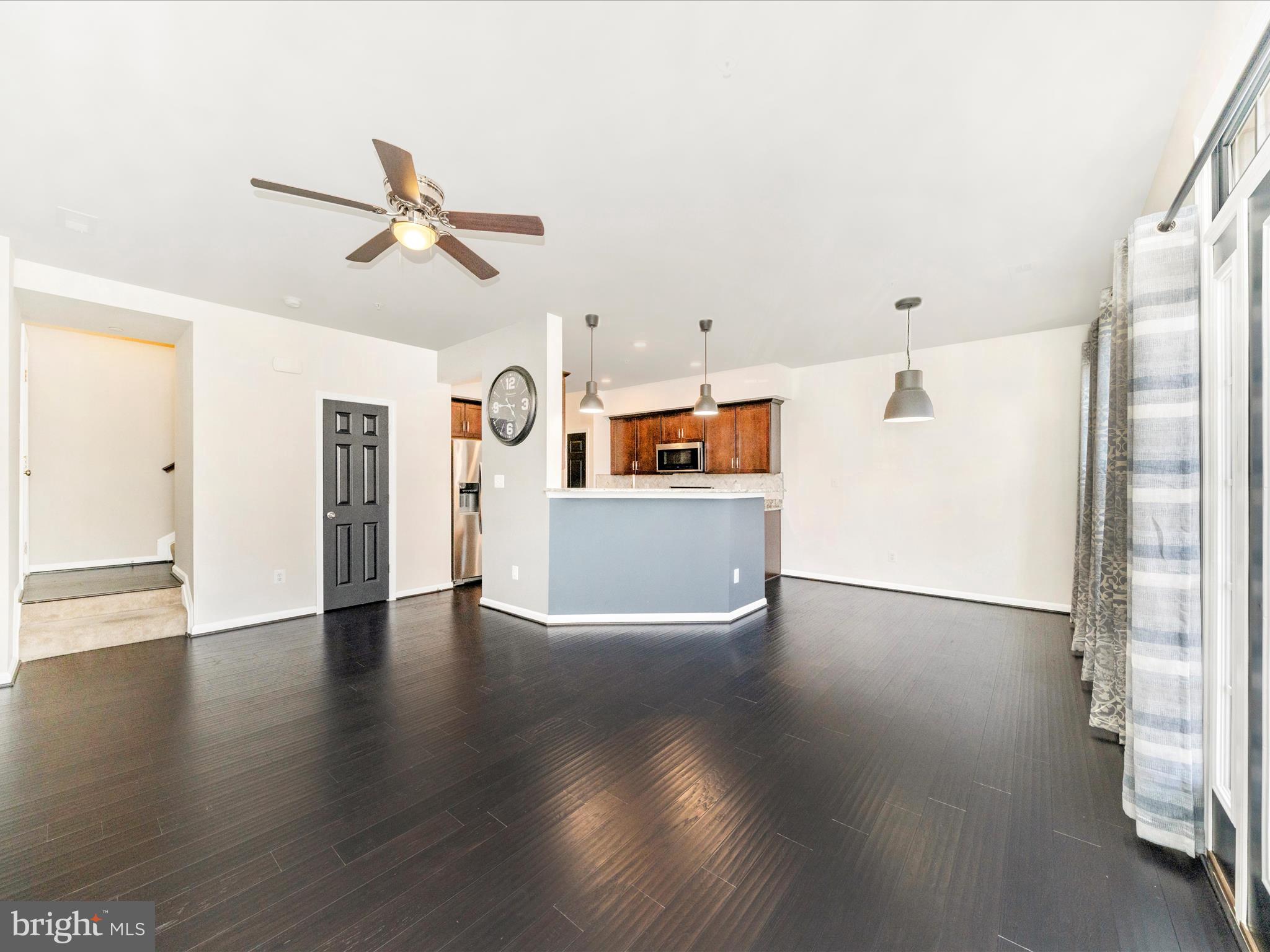 5880 Imperial Drive Frederick, MD 21703 - Photo 11 of 54 a view of a kitchen with furniture and wooden floor