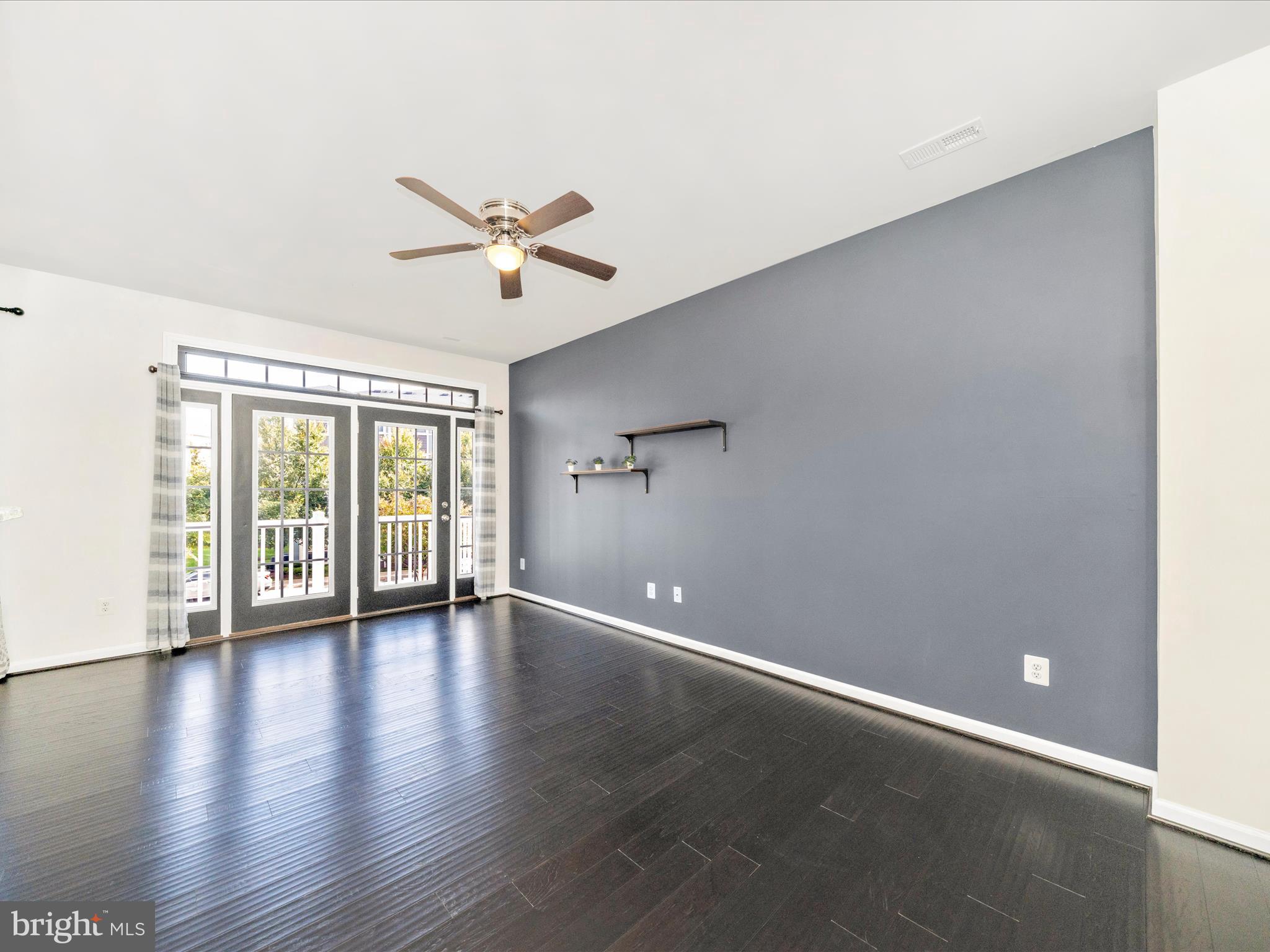 5880 Imperial Drive Frederick, MD 21703 - Photo 13 of 54 wooden floor in an empty room with a window